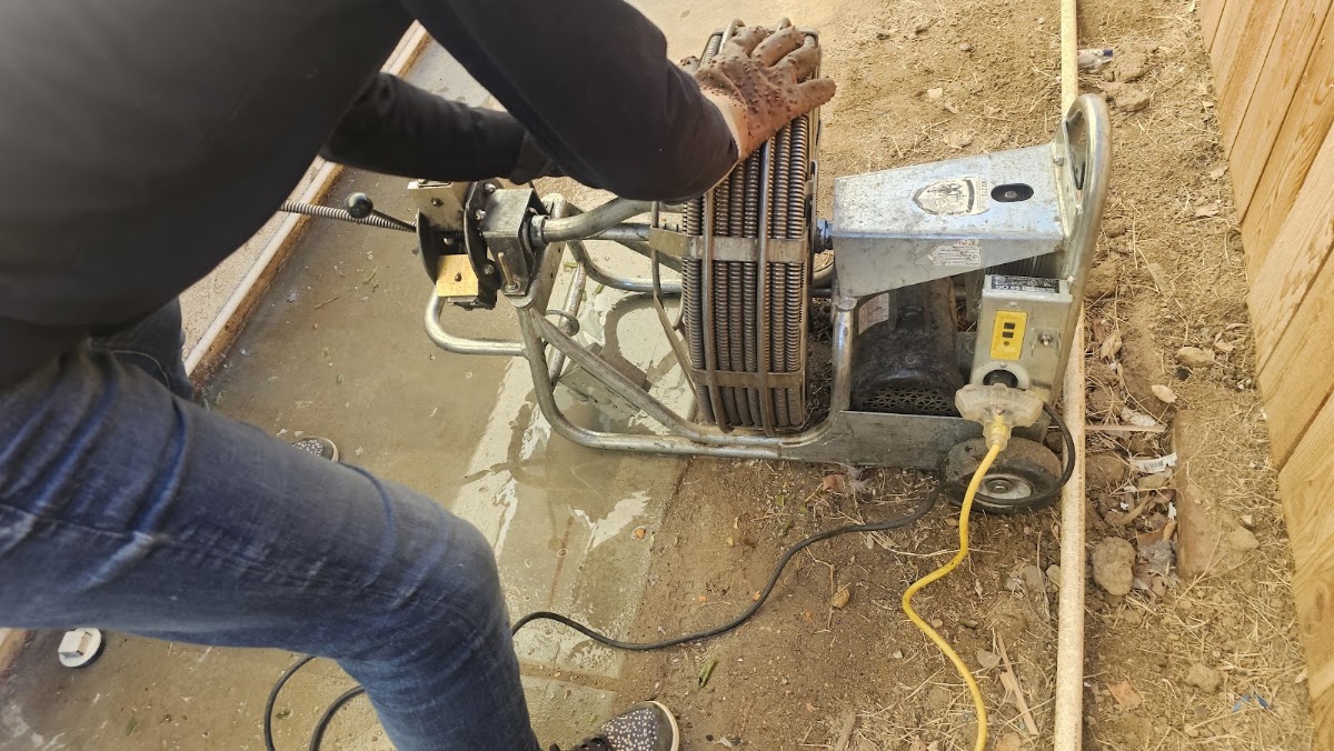 Close view of the sectional cable machine feeding a drain line