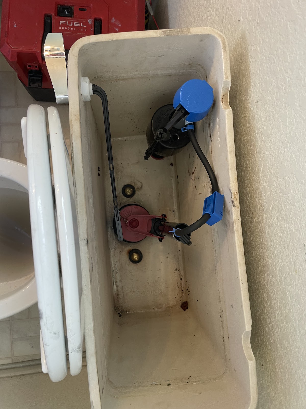 Toilet tank rebuilt with a new fill valve and flapper